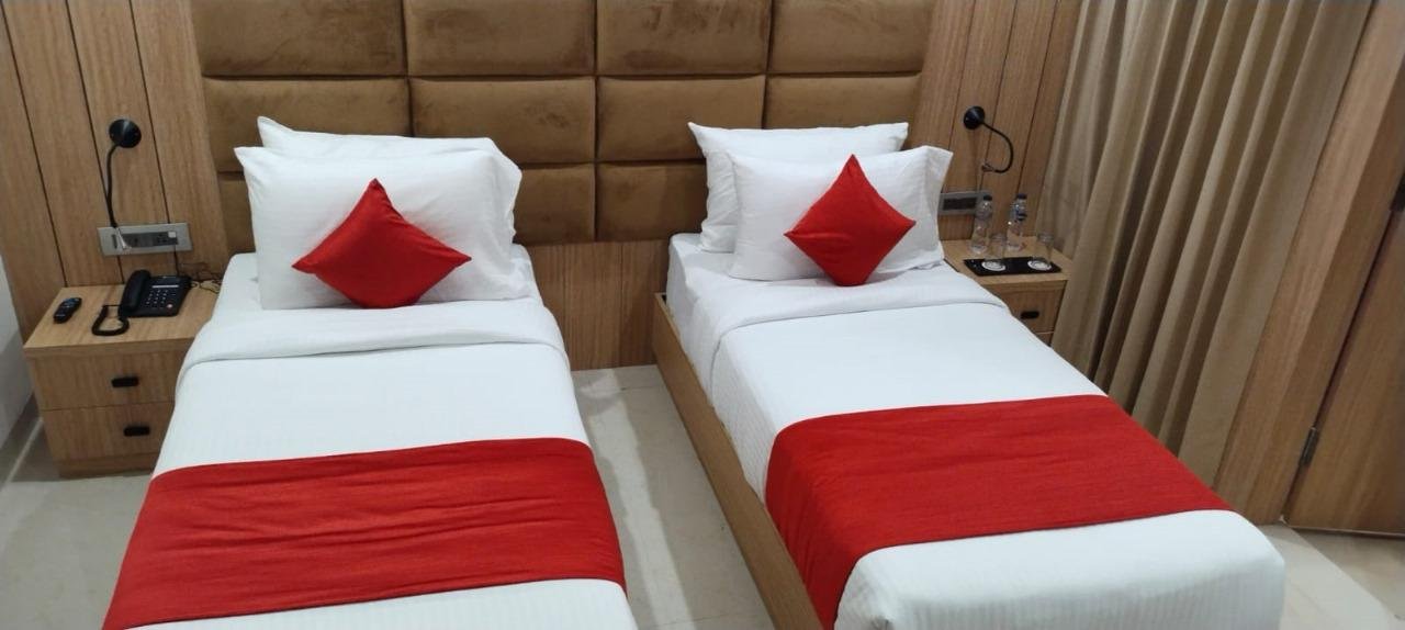 The Royal Legacy Premium Twin Bed Room with Golden Drapes